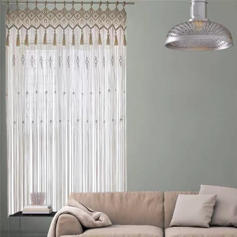 A beautiful hand-woven bohemian tapestry curtain that adds texture and style to a room.