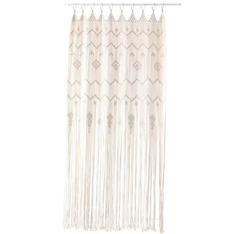 A hand-woven bohemian tapestry curtain used as decorative decor